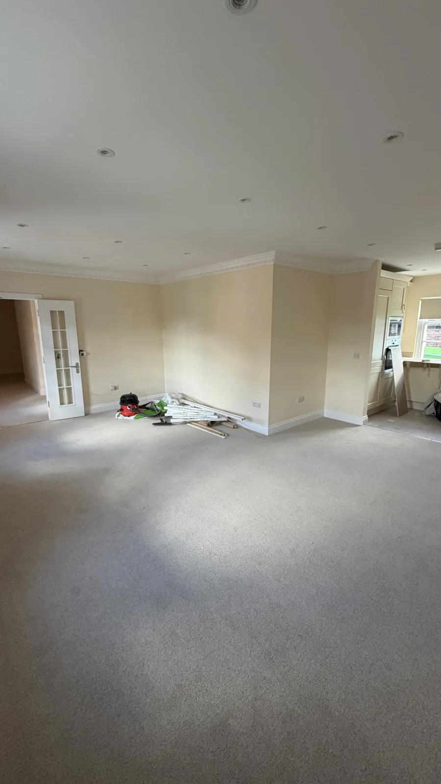 Grey carpet fitted across a large interior room