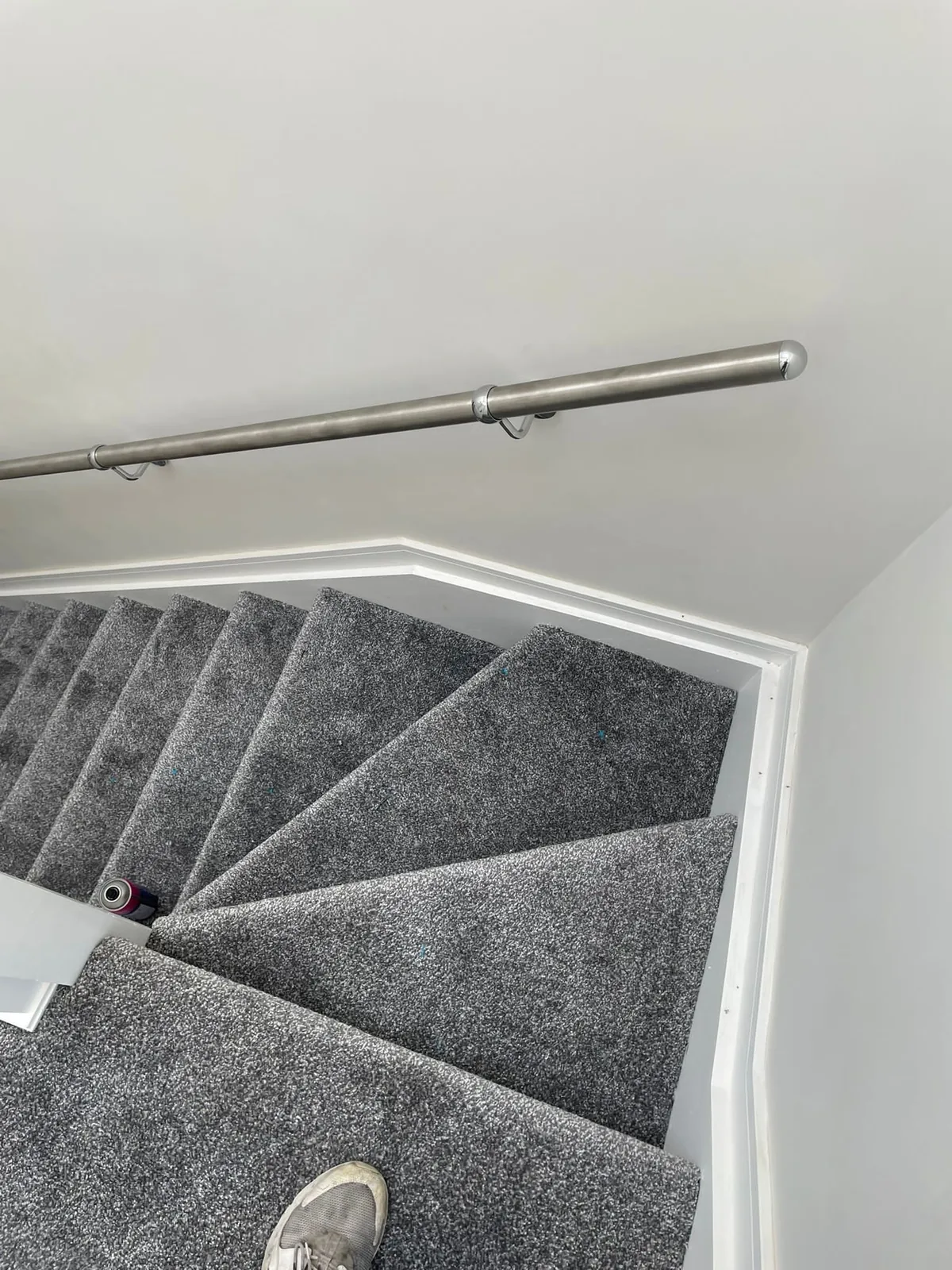 Grey carpet fitted on turning stairs