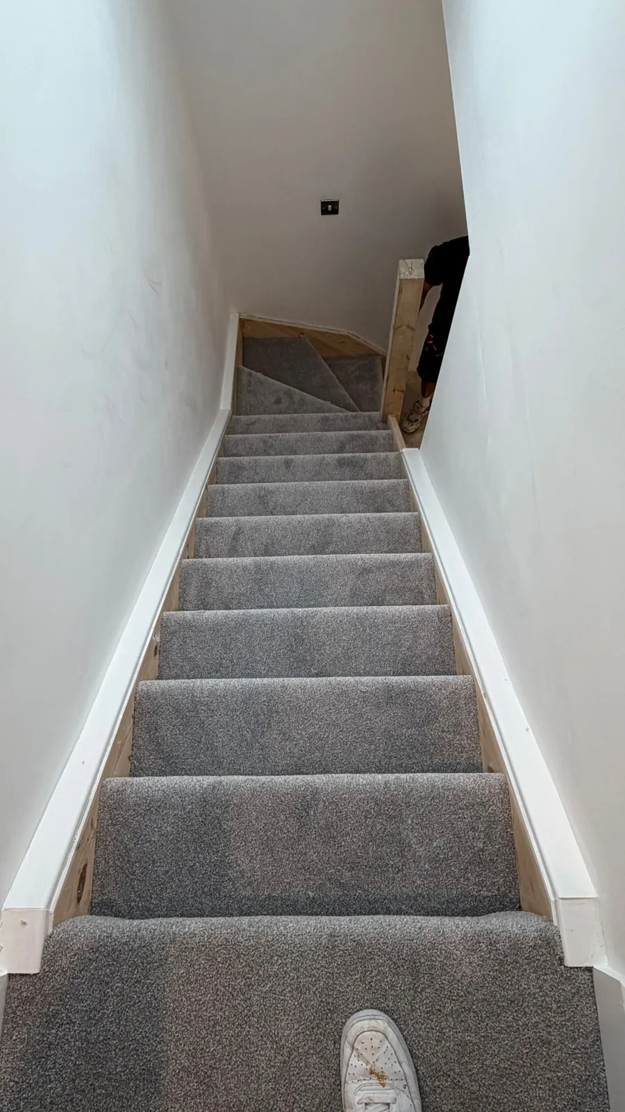 Striped carpet runner fitted on a staircase