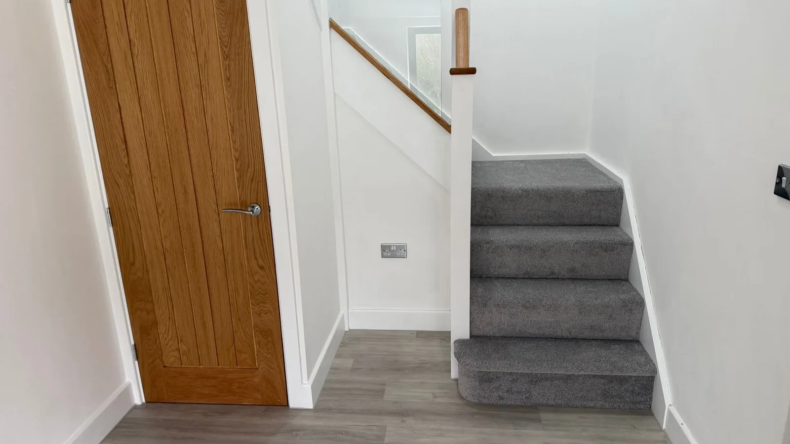 Grey carpet fitted across stairs and landing