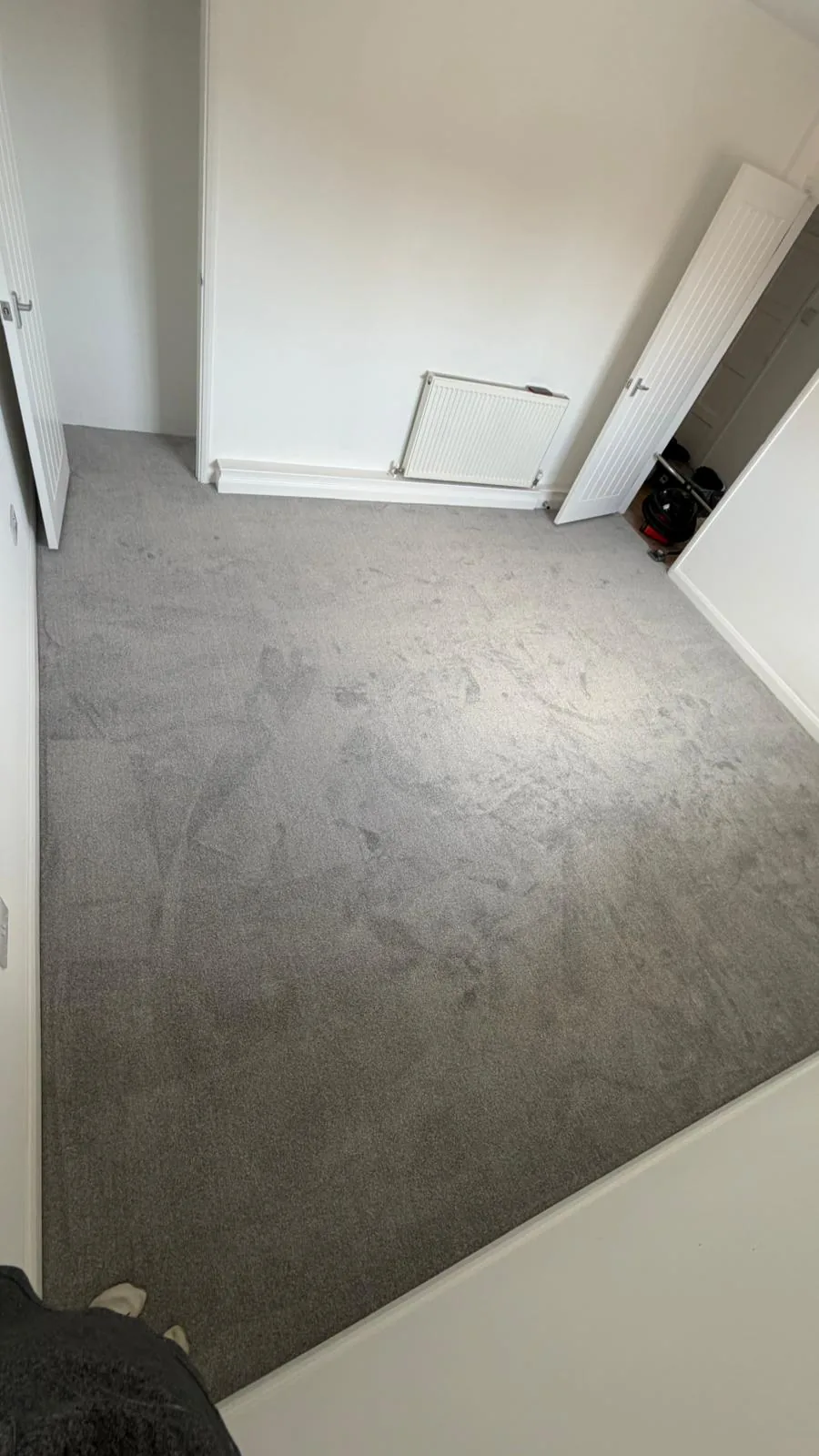 Grey carpet fitted on steps and an adjoining floor
