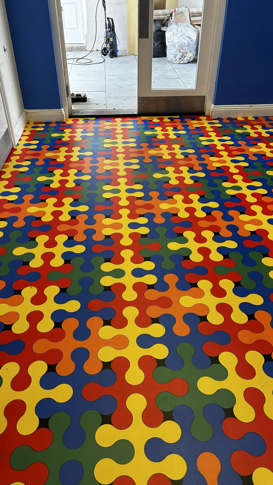 Colourful patterned vinyl flooring in a corridor