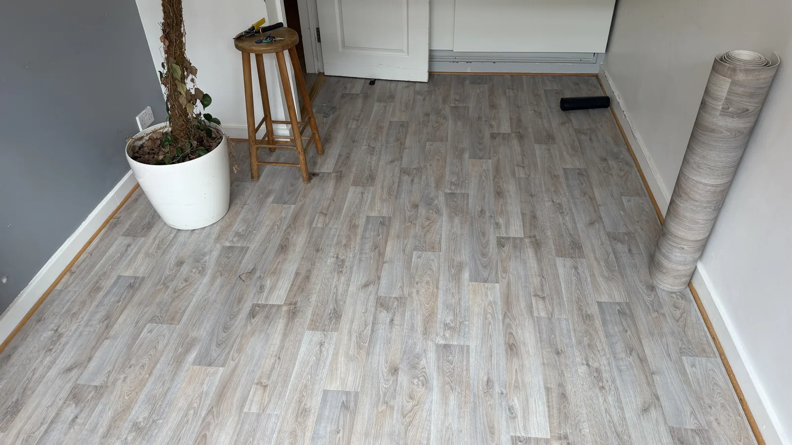 Light wood-effect vinyl flooring in a living space