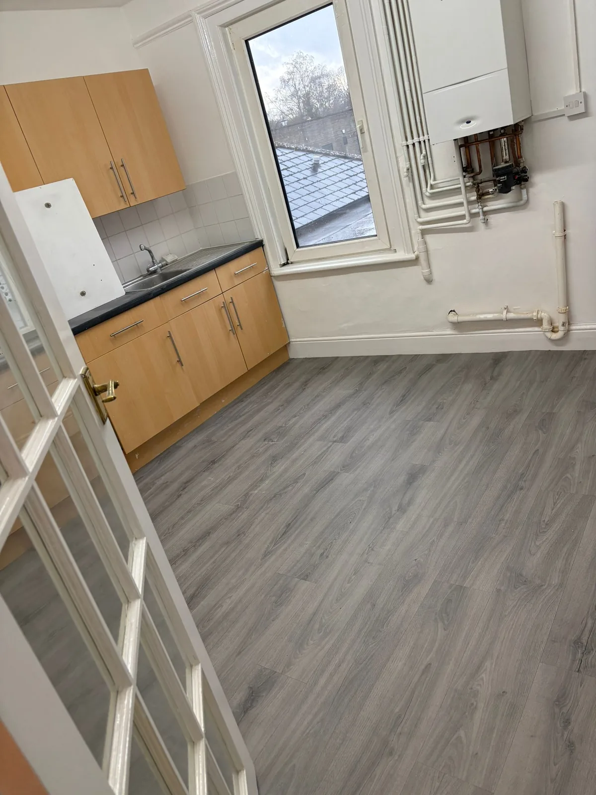 Grey wood-effect vinyl flooring in a kitchen