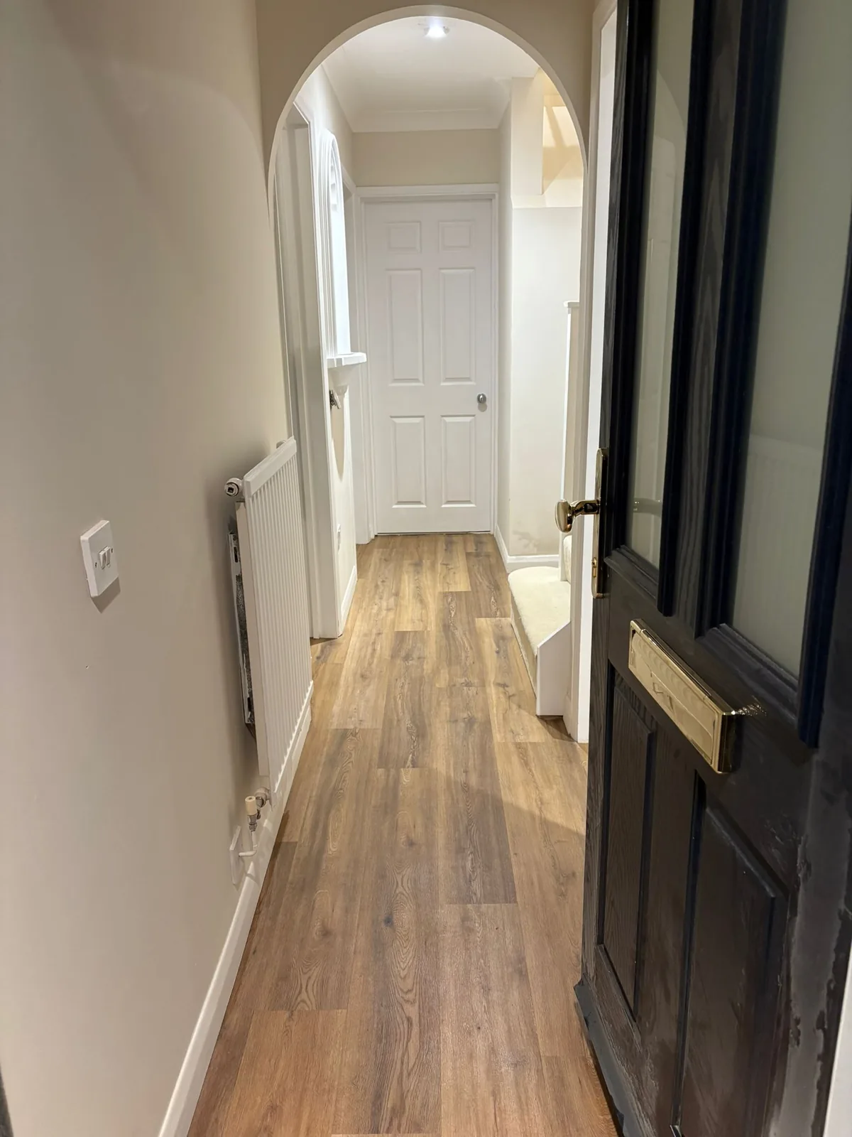 Wood-effect LVT fitted along a hallway