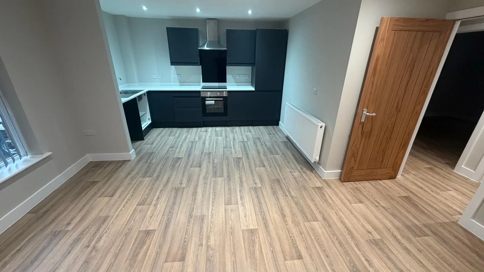 Wood-effect LVT fitted across an open-plan interior